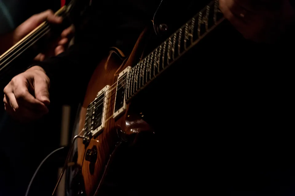 Close-up of a guitar being played