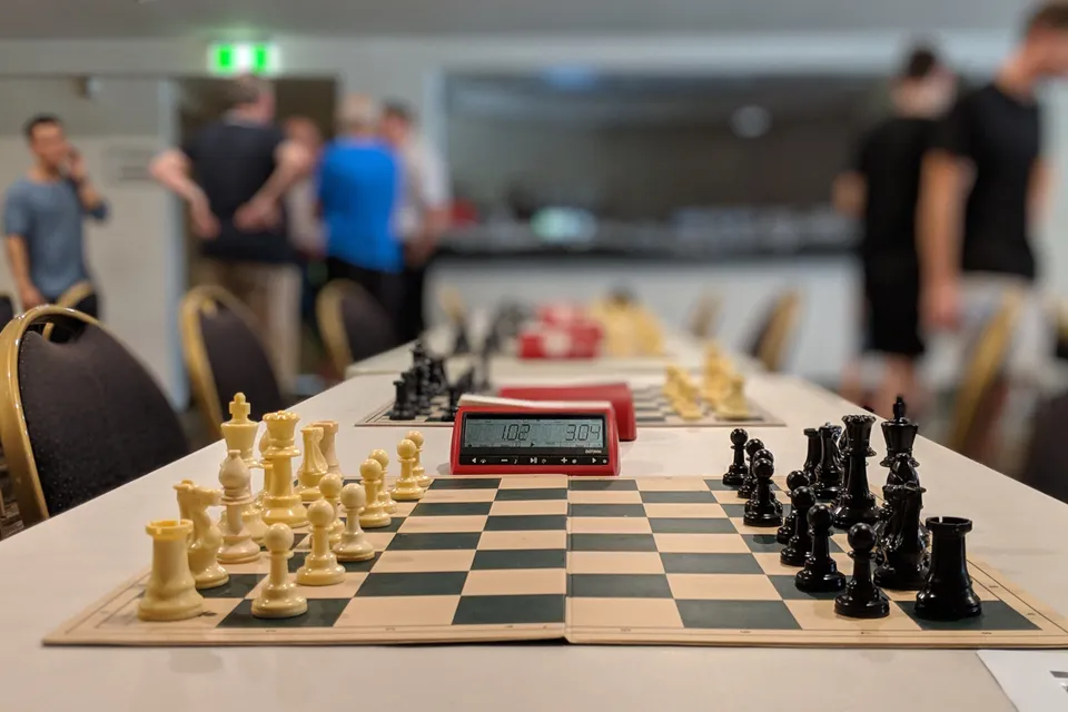 Chess game in progress on a tournament table