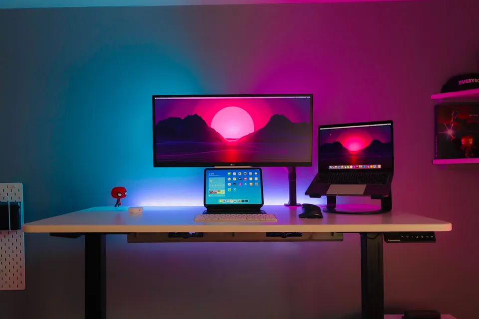 Colorful home office with multiple screens
